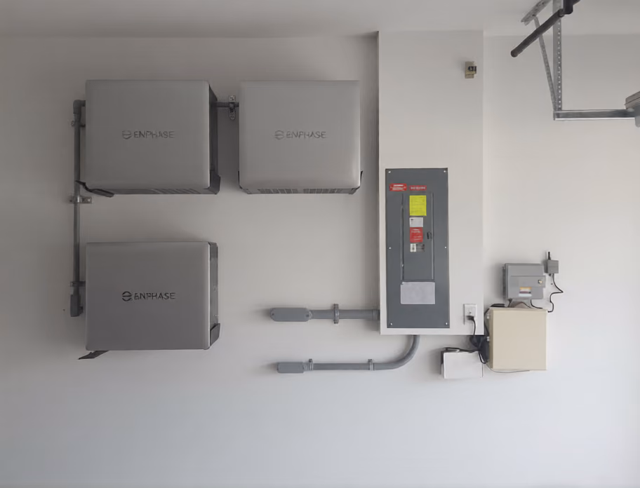 Three Enphase IQ Battery 10C units installed in a Florida garage by May Electric Solar