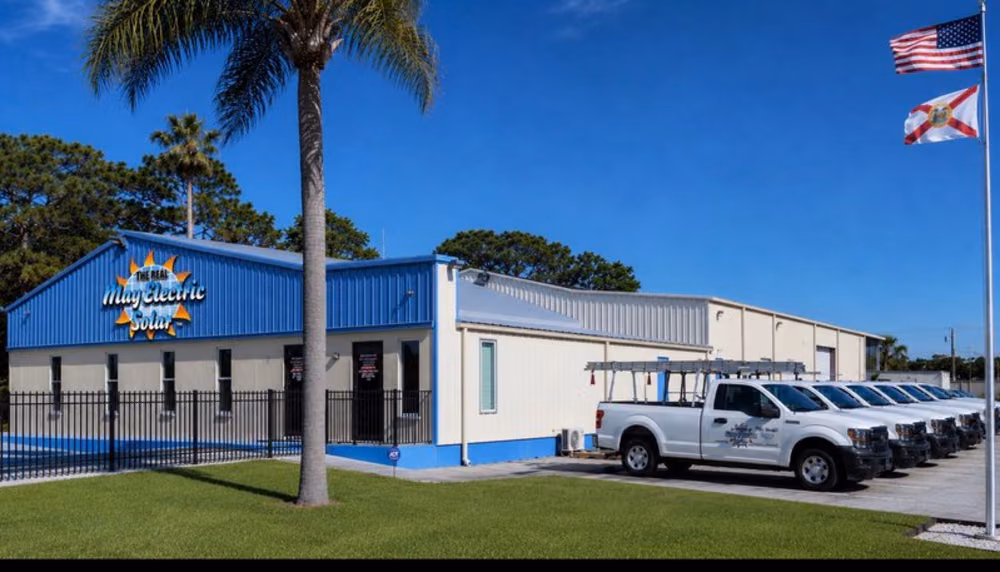 May Electric Solar headquarters in Hudson, FL with the company's fleet of service trucks